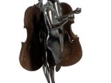 statue of a woman holding a violin and a cello on a pedestal