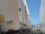two trains that are sitting side by side on the tracks