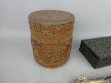 a wooden box, a knife, and a box on a table