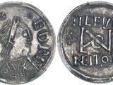 a close up of a coin with a woman ' s face on it