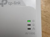 a close up of a small white device on a table