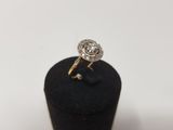a close up of a diamond ring on a black ring holder