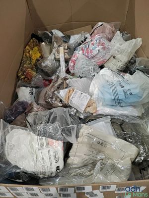 a cardboard box filled with many different types of items
