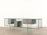 an image of a glass table with two drawers on top of it