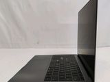 an open laptop computer sitting on top of a white table