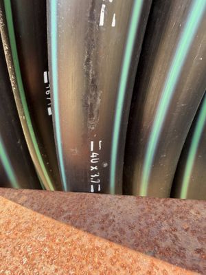 a lot of pipes that are stacked up together