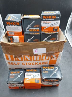 several boxes of various size and type of tools are stacked on top of each other