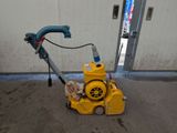 an image of a yellow machine that is sitting on the ground