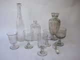 a lot of glass items that are sitting on a table