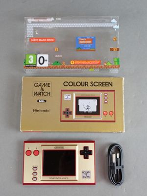 a nintendo game console and a nintendo game controller next to each other