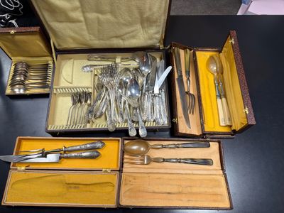 many different types of silverware in this case