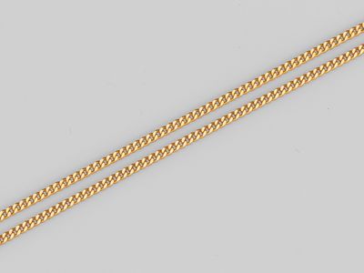 une chaîne en or jaune 18 carats avec un fermoir serti d'un diamant