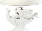 a white table lamp with a white shade on it