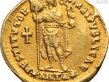 a gold coin with an image of a man holding a sword