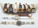 many different types of watches on a pillow