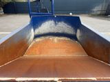 an image of a rusted truck bed in a parking lot