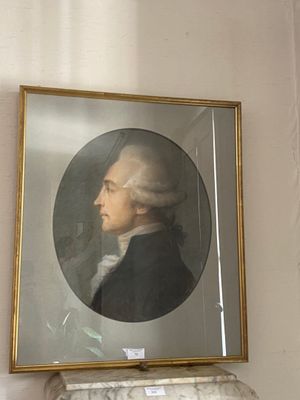 a painting of a man in a black suit on a wall