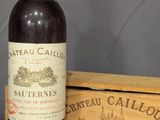 une bouteille de vin à côté d'un carton de vin