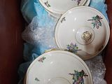 three bowls in a box on a blue cloth
