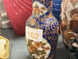 many vases that are sitting on a table