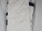 a picture of a pair of white pants hanging on a clothes rack