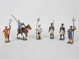 six figurines of different types of people on horses and horses