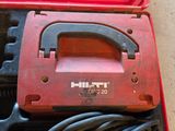 a red tool box with tools in it on the floor