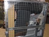 a large metal cage with a bunch of items in it