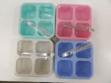 four plastic trays with spoons and utensils in them