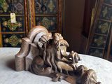 a statue of a lion on a table in a room