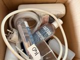 a cardboard box with a bunch of electronics inside of it