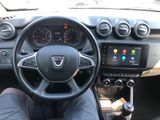 the dashboard of a car with a person sitting in the drivers seat