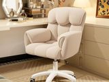 a chair that is sitting in front of a desk