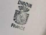 a close up of a plate with a logo on it