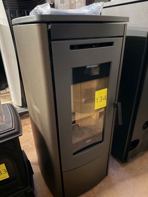a stove that has a glass door on top of it