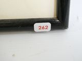 a picture of a black frame with a white number on it