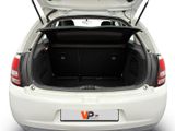 the back of a white car with its trunk open on a white background