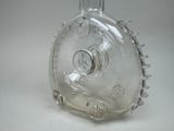 a clear glass bottle with a spiky design on it