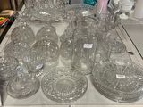 a lot of glassware on a table in a store