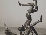 a black and white photo of a man doing a handstand