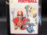a close up of a box with a football game on it