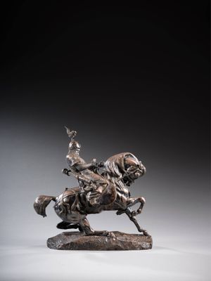 an image of a bronze statue of a man on a horse