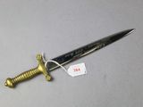 a knife that is laying on a table with a price tag on it