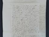 a piece of paper with writing on it sitting on top of a table