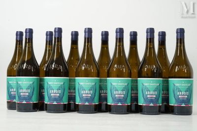 six bottles of wine are lined up in a row on a table