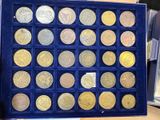 a display case with a lot of coins in it