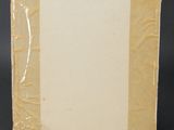 an old picture frame with a piece of paper taped around it