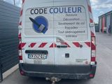 a white van that is parked in front of a building