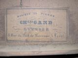 a sign on the back of a suitcase that says chicano