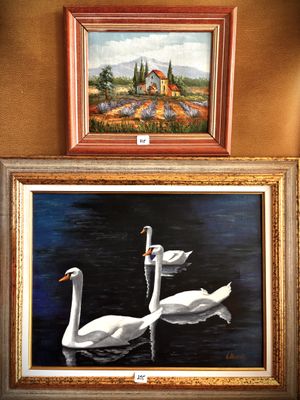 two paintings of swans on the wall next to each other